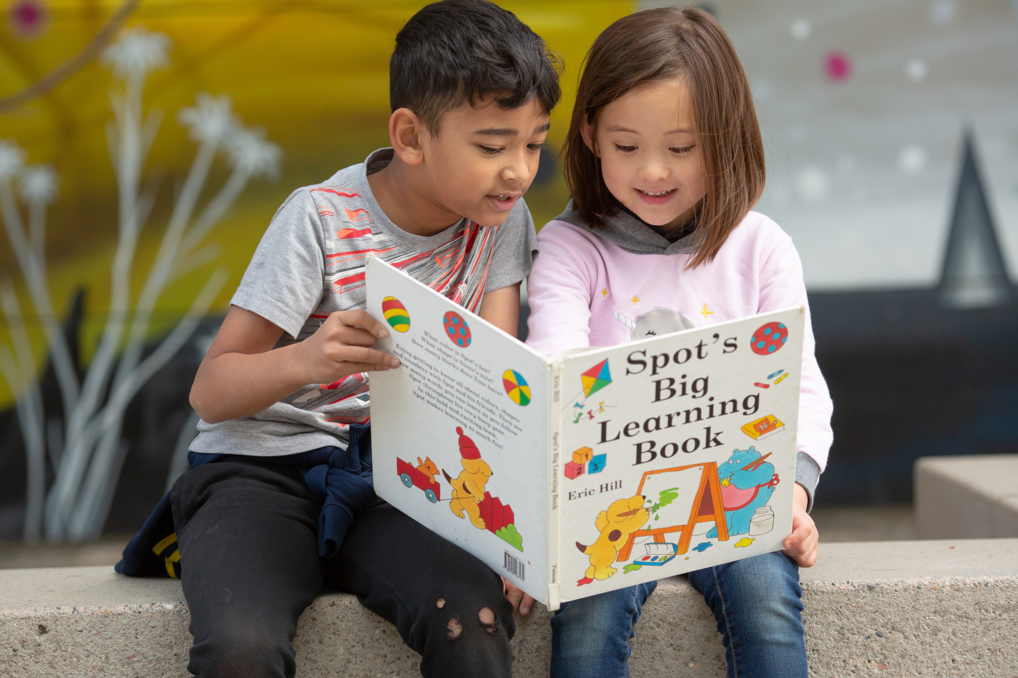 Boy and Girl read Spot's Big Learning Book